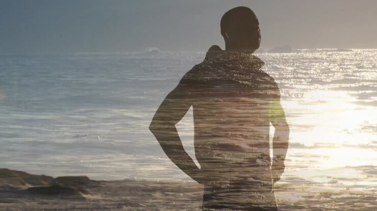 Animazione di un paesaggio marino su un uomo afroamericano che si allena, fa una pausa e si stira