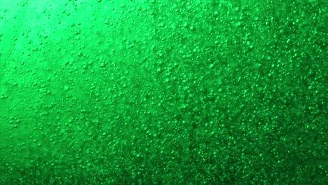 water drops on green liquid, air bubbles in green liquid hand soap