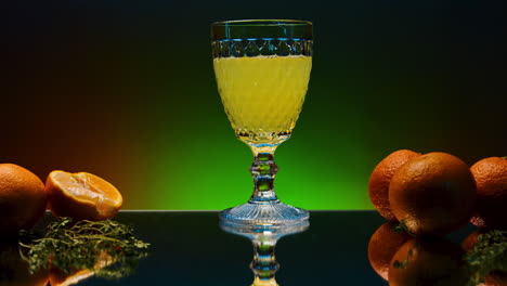 orange juice in a glass with oranges