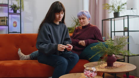 unhappy sad lesbians were surprised by positive pregnancy test result and became very upset at home