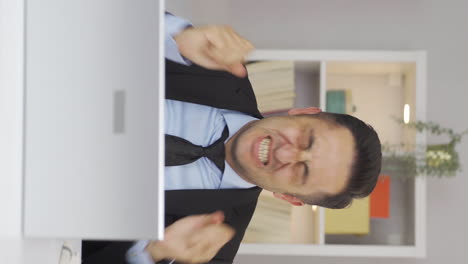 vertical video of home office worker man having a nervous breakdown.