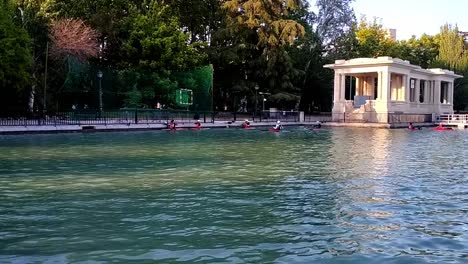 shot of a game of kayak polo in the big pond at retiro parl, madrid