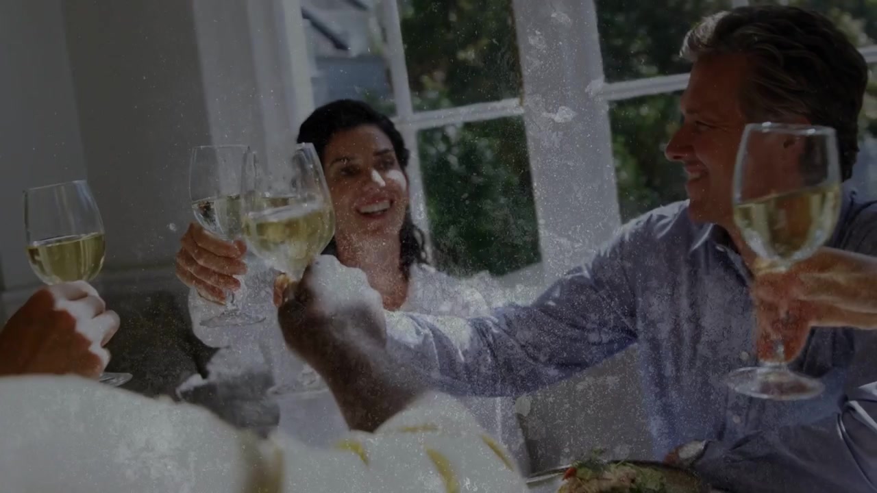 Arms reaching starting dining toast group raising wine glasses crackle overlay partly masking scene