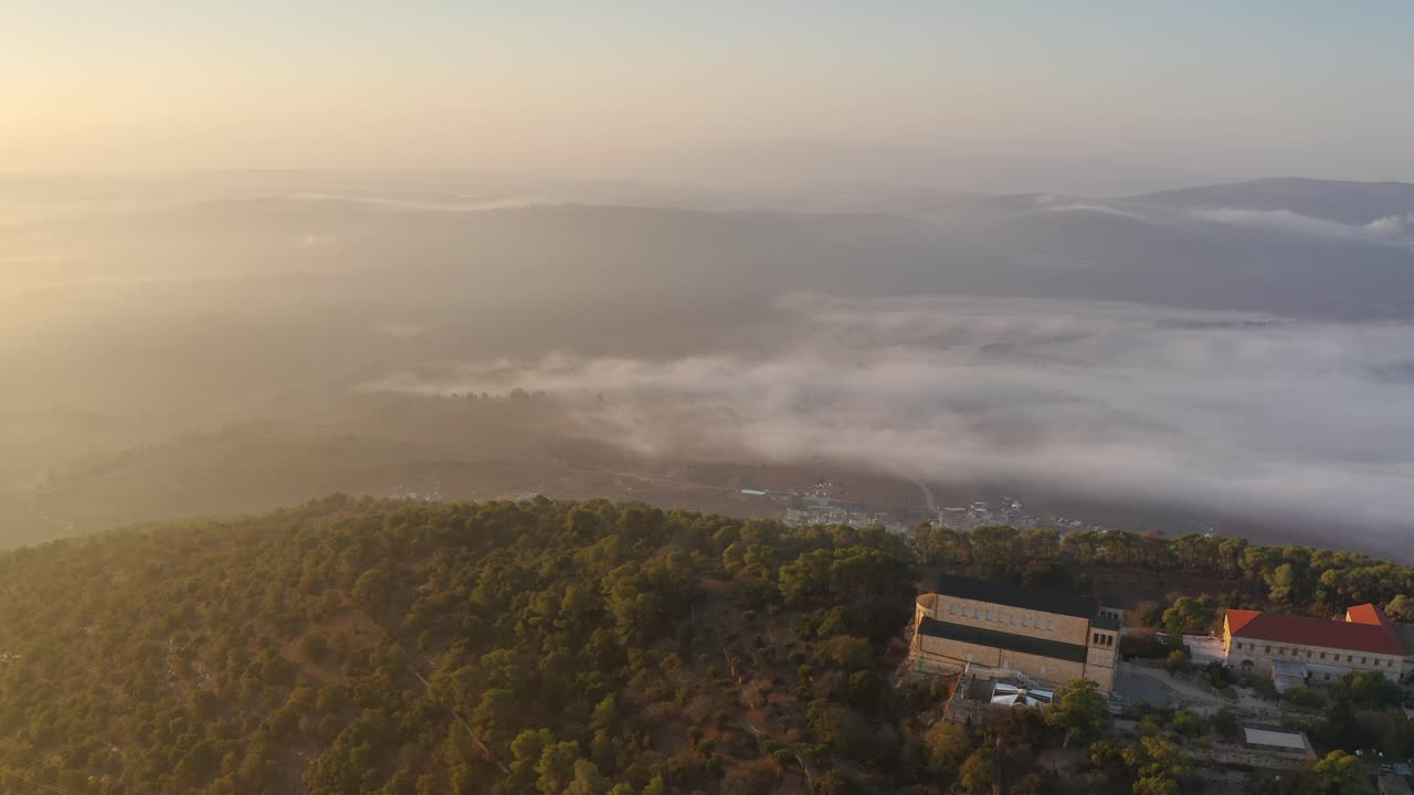 Sunrise over Mountains and Misty Valley with Church