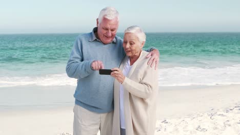 old couple taking selfie with smartphone
