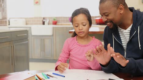 Father-helping-her-daughter-in-her-studies-4k