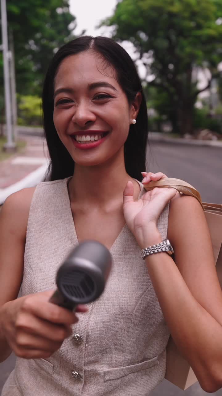 Woman with a hair dryer