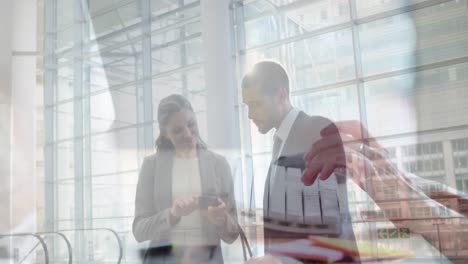 Animation-of-caucasian-businesswoman-shaking-hands-and-using-computer