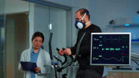 Team-of-medial-researcher-monitoring-vo2-of-man