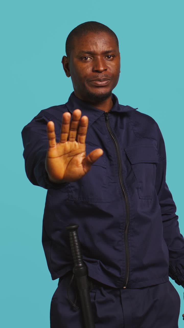 African American Security Guard Making Stop Gesture