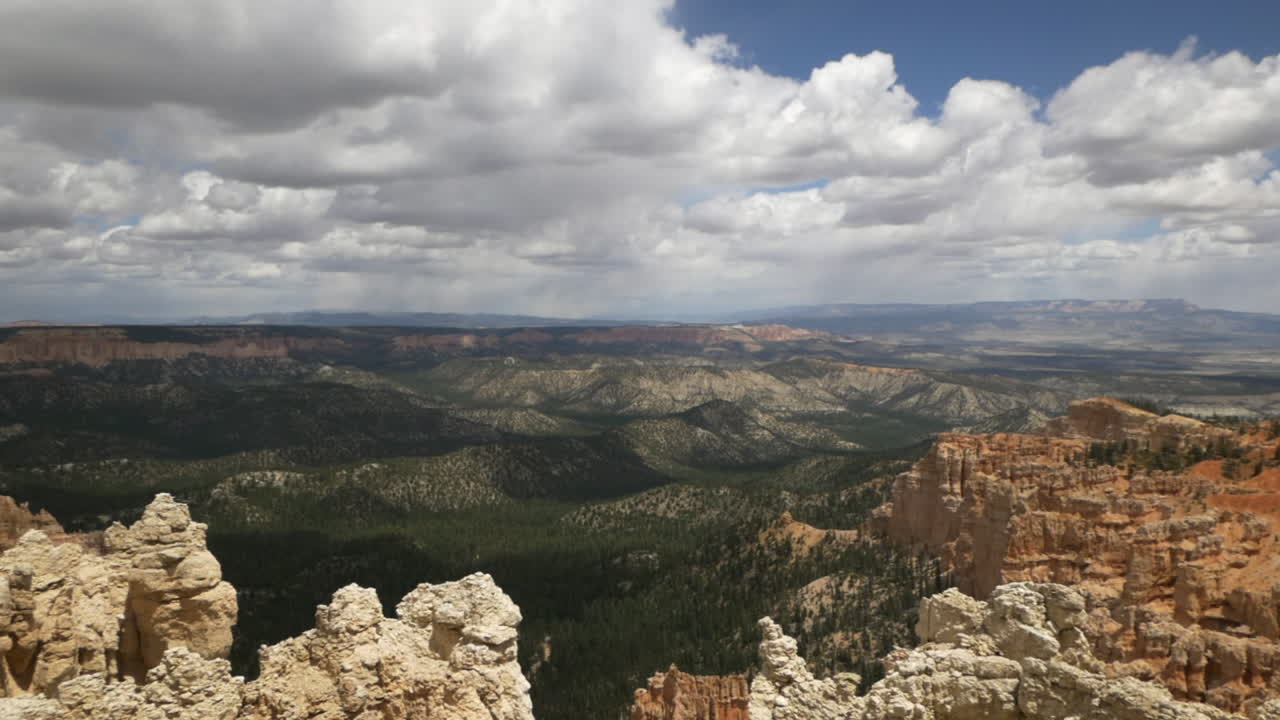 Epic panorama rolling clouds and sandstone formations, dense forest, Bryce National Park, Utah