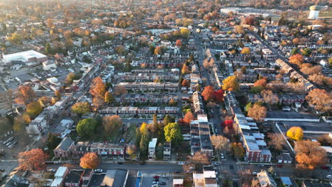 High-aerial-truck-shot-of-American-city-during-golden-hour-light