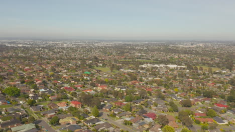 Camera-smoothly-tilts-upwards,-presenting-perspective-of-the-suburban-landscape