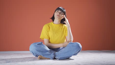 woman looking thoughtfully at camera.