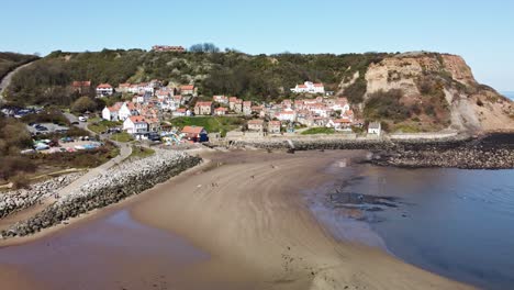 aerial drone view of runswick bay village, yorkshire coast