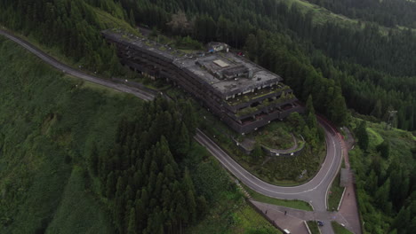 aerial: monte palace hotel ruins amidst lush são miguel forests azores