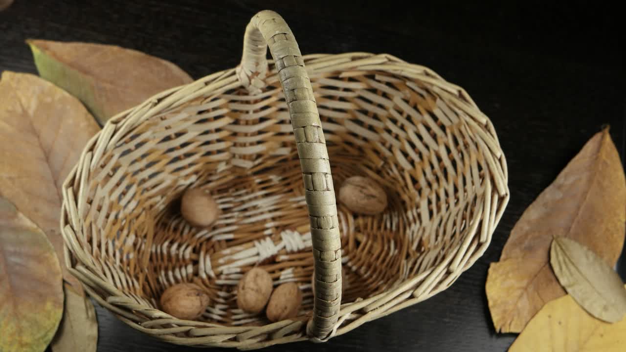Wicker basket are filling by walnuts