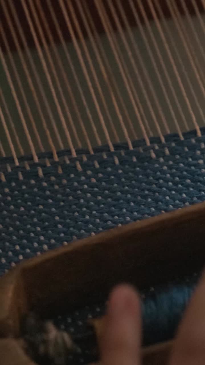 Close-up of Hand Weaving on a Loom