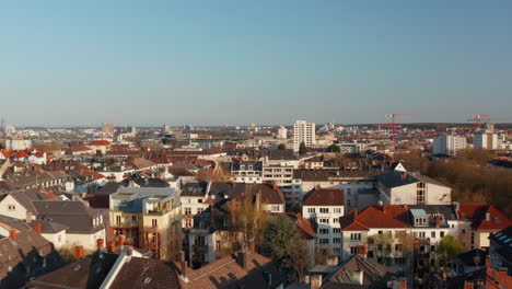 Panorama-curve-shot-of-large-town.-Aerial-view-of-Bornheim-neighbourhood-from-drone.-Frankfurt-am-Main,-Germany