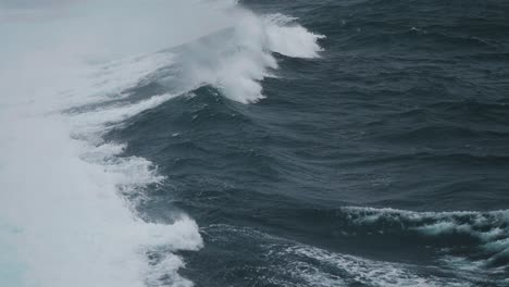 heavy white-crested waves in the open sea