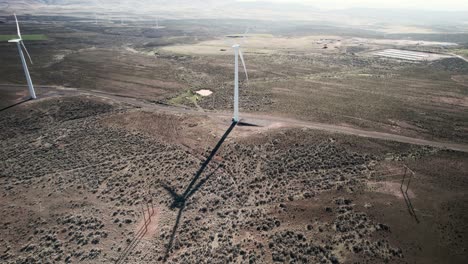 High-above-a-wind-energy-farm,-green-sustainable-carbon-neutral-electricity,-aerial-orbit