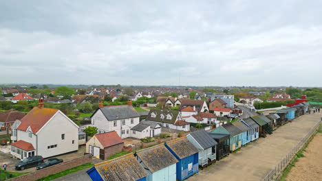 Aerial-shots-capture-the-essence-of-Mablethorpe's-east-coast-allure,-featuring-beach-huts,-sandy-beaches,-and-lively-amusements