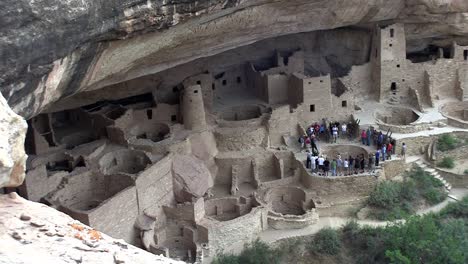 mediumshot of the ruins of native american cliff dwellings in mesa verde national park