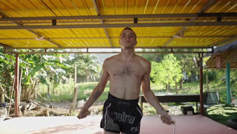 man exercising with jump rope outdoors