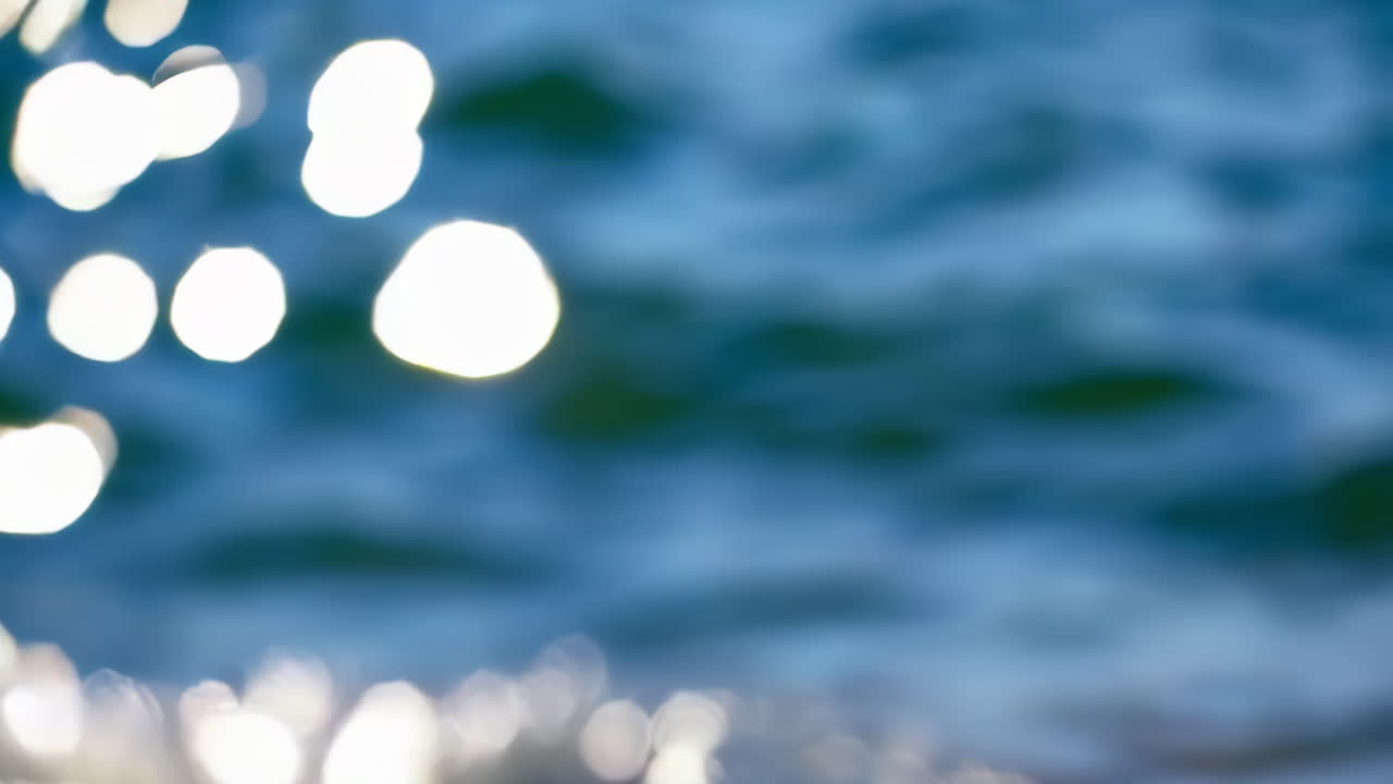 Blurred Water Surface with Sun Reflections