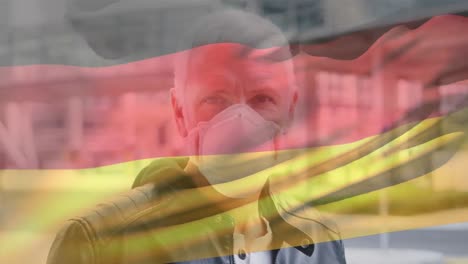 animation of flag of germany over man wearing face mask