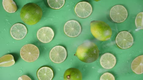 the round slices of lime falling water drops.