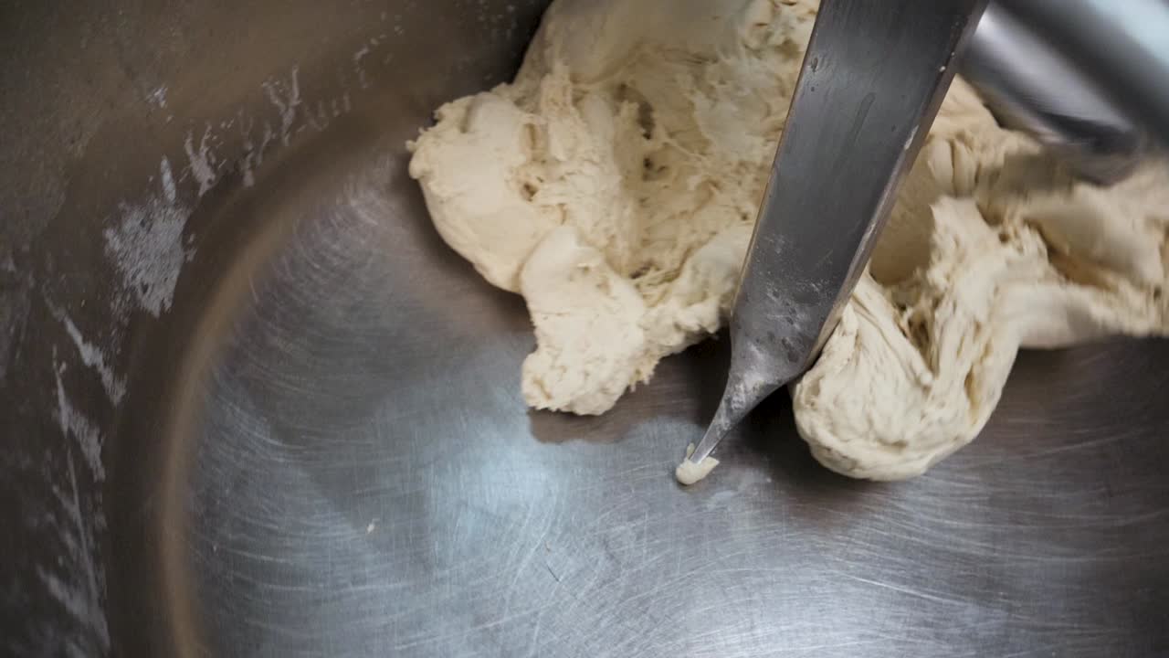 Dough being mixed in a commercial mixer