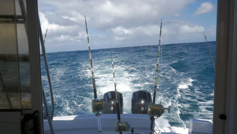 yachts with fishing tackles sailing in ocean