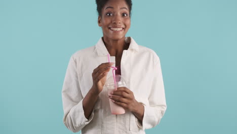 Pensive-girl-drinking-delicious-strawberry-milkshake