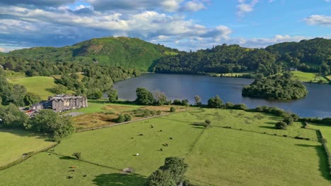 cinematic summer aerial view of the lakeland town of grasmere