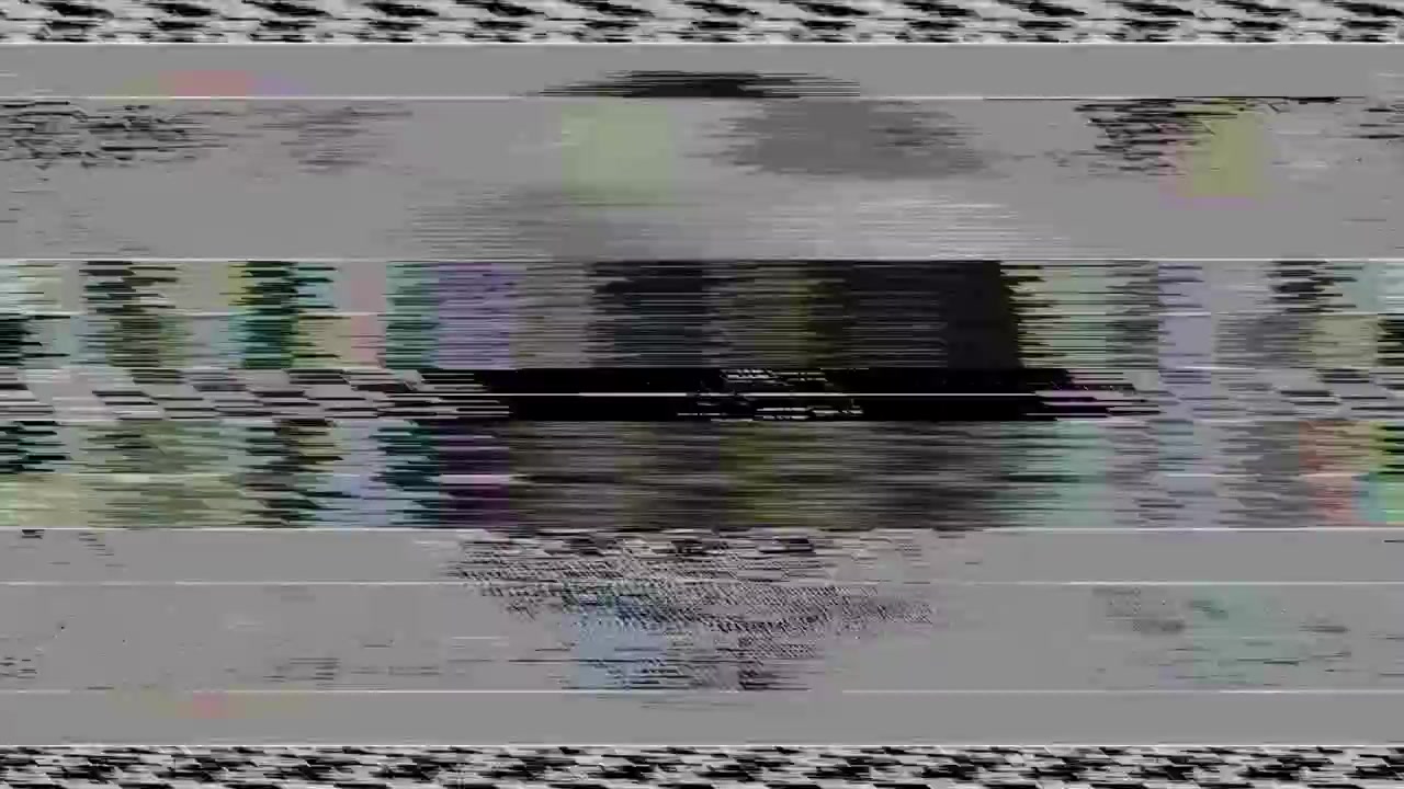 GLITCH: TV interference, static, distorted test card or test pattern with colour static and noise