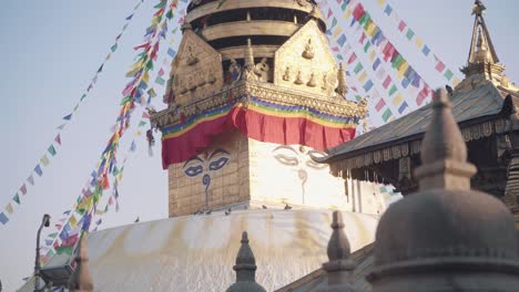 eyes of swayambhunath stupa with roof structure of ancient temple in kathmandu, nepal. - wide shot