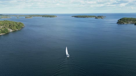 A-sailboat-sails-through-skerries-on-the-coast-of-Sweden-on-the-baltic-sea