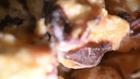 macro close-up of chocolate stripped caramel corn popcorn treat