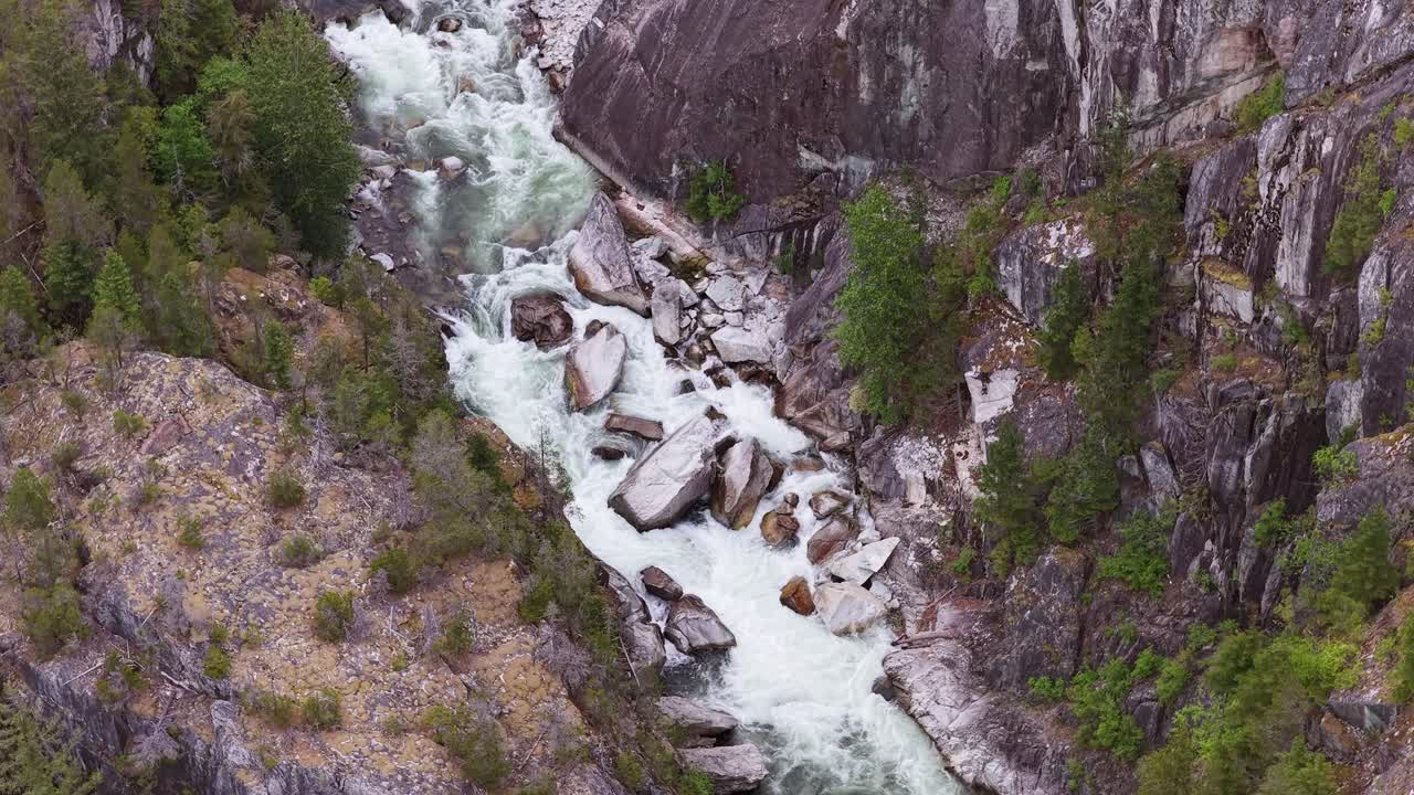 Dramatic White Water River Rushing Through a Deep Rocky Canyon in British Columbia, Canada