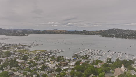 sausalito city california aerial v3 drone flyover charming town towards dunphy park overlooking at belvedere tiburon across richardson bay on a cloudy day - shot with mavic 3 cine - june 2022