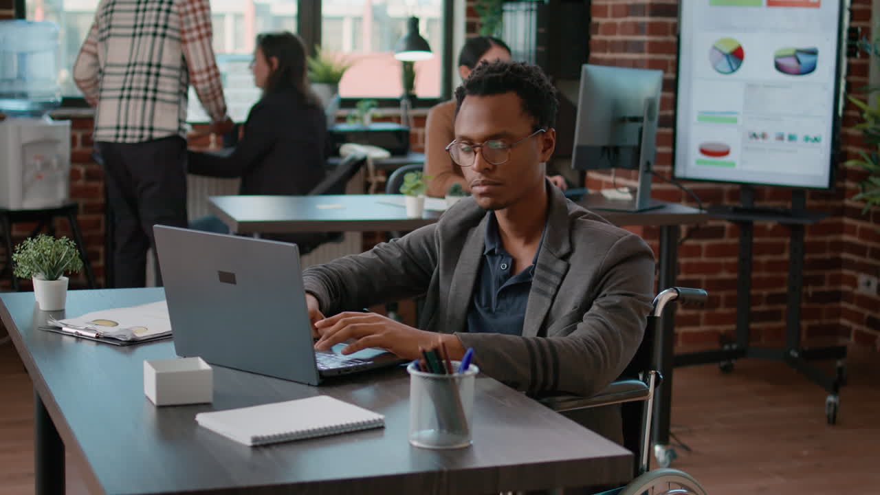 Portrait of person with disability smiling at camera at preparing
