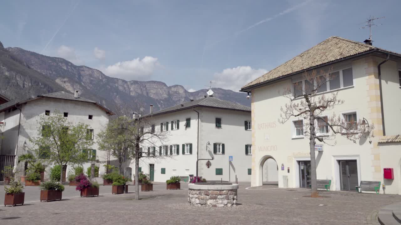 Quiet main square in the town centre of Kurtinig - Cortina, South Tyrol, Italy on a sunny day in spring
