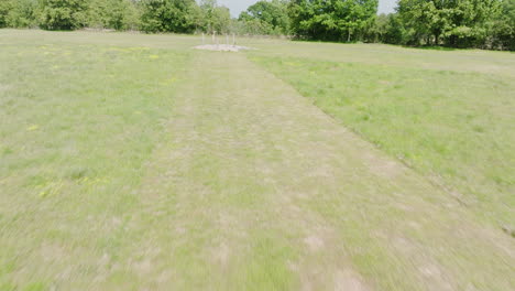 Flying-Above-Towards-Target-Posts-At-Rifle-Range-In-Leach,-Oklahoma