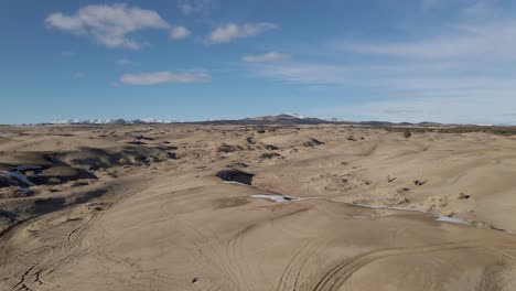 Flying-Above-Little-Sahara-Sand-Dunes-In-Winter