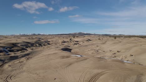 flying above little sahara sand dunes in winter