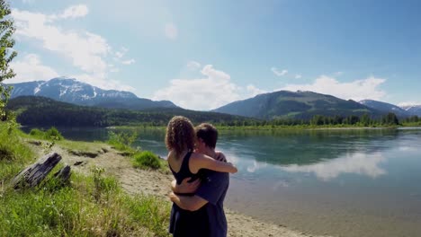 couple hugging near lakeside 4k