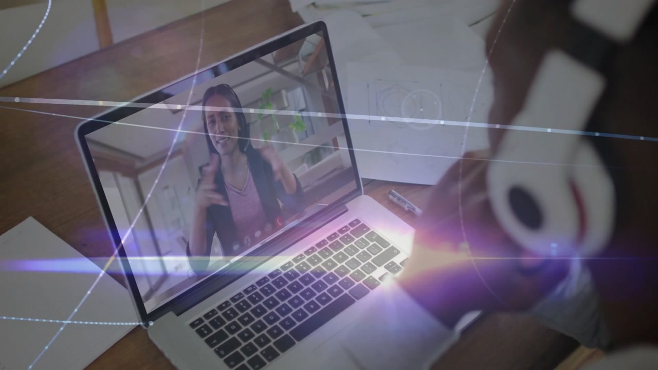 Woman gesturing on laptop initiating network visuals while man leans in tech call showing data flow