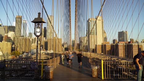 lower manhattan buildings and scyscrapers as seen from brooklyn bridge