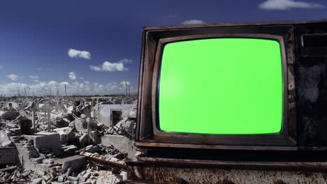 old vintage television with green screen in a ghost town. zoom in. 4k resolution.